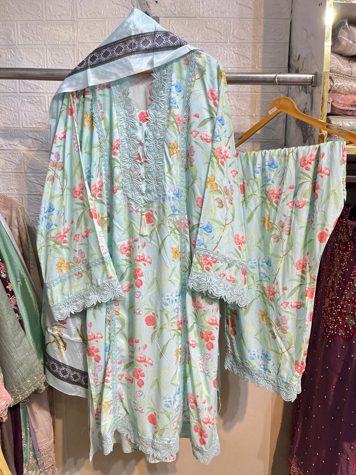 A light mint green floral print kurta with lace trim and a patterned border with pure silk printed full size dupptta 
